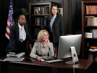 Three women of law researching case information and details online