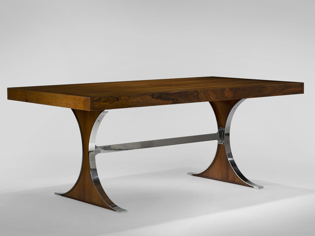 Rene Jean Caillette, Sylvie Dining Table, with drawers on ends, 1961, Pallisander, steel, acajou, 28.74 H x 72.83 x 37.4 inches, 73 H x 185 x 95 cm. With extensions: 28.74 H x 122.25 x 37.5 inches. Image courtesy of Demisch Danant. Photo by Thierry Depagne.
