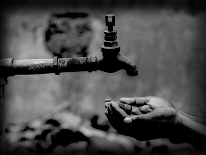 Hands looking for water from a tap. According to UNICEF, almost two-thirds of the world’s population experience severe water scarcity for at least one month each year