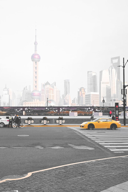 Yellow taxi on road near city buildings during daytime, The Bund, Shanghai, China