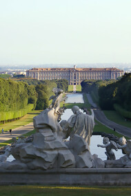 The Royal Palace of Caserta seen from the fountain of Venus and Adonis inside the Royal Park, Italy