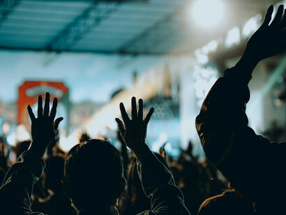 People gathered in protest, arms lifted high in defiance against state authority