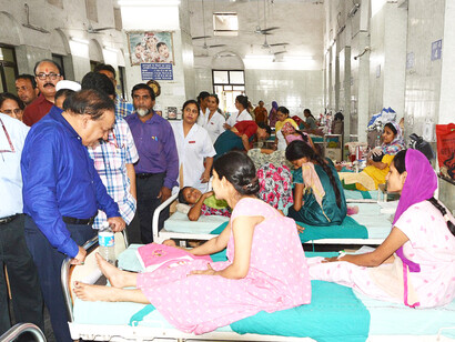 Dr. Harsh Vardhan, Union Minister for Health and Family Welfare, interacts with patients during his visit to Lady Hardinge Hospital in New Delhi on October 2, 201