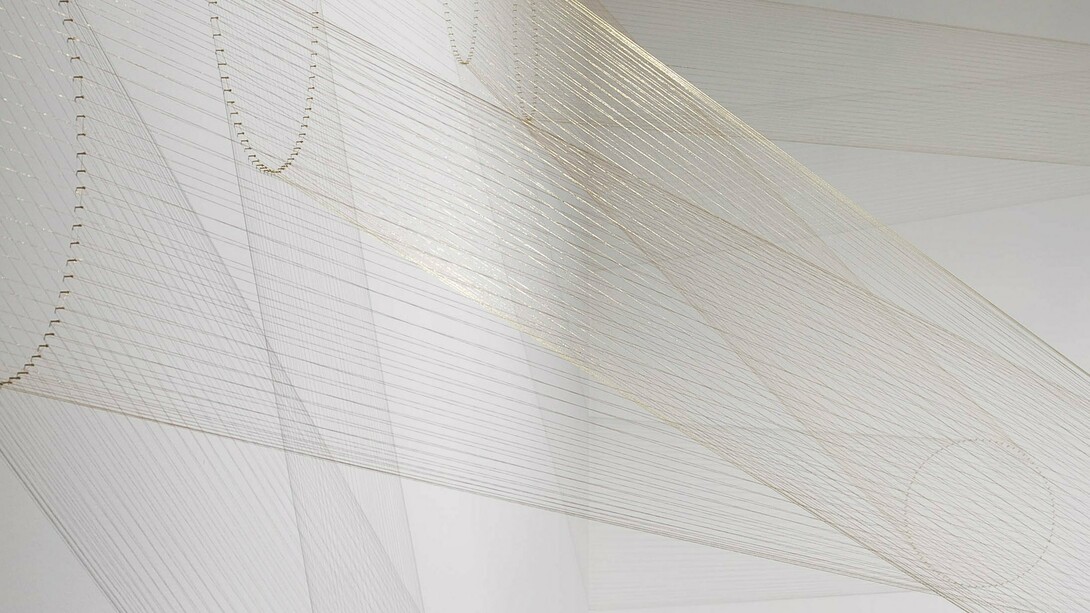 Lygia Pape,
Ttéia 1,B (detail),
2000,
Golden nylon thread, nails and light
© Projeto Lygia Pape. Photo: Paula Pape
