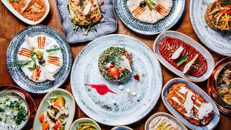 The table is adorned with a stunning display of Turkish appetizers, creating an authentic visual feast that captures the essence of the cuisine