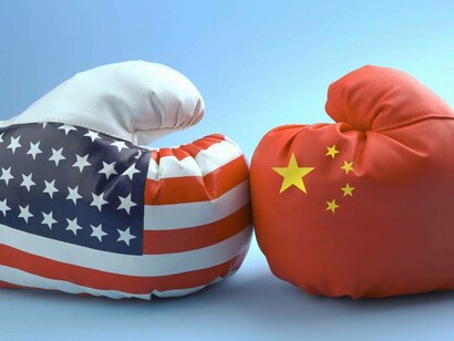 American boxing glove side by side with a Chinese boxing glove which can only single war between the two