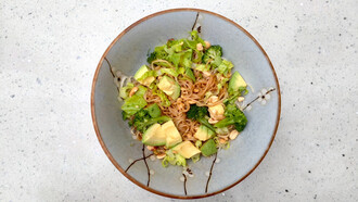 A bowl of avocado and wasabi noodles