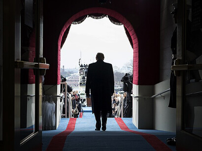 President Donald Trump arrives at his inauguration ceremony, stepping onto the Capitol steps to begin his term as the 45th President of the United States, greeted by a crowd of supporters and dignitaries