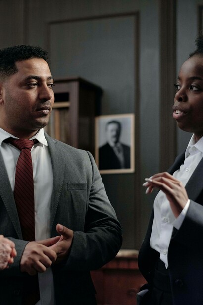 Government sector employee explains challenges to businessman 