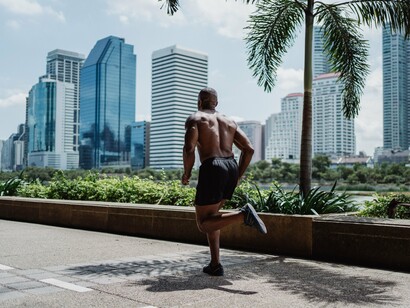 A fitness enthusiast jogging through a park, reflecting how staying active supports long-term heart wellness