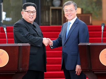 President Moon Jae-in and Chairman of the State Affairs Commission Kim Jong-un are shaking hands after announcing the Panmunjom Declaration for the inter-Korean summit in front of the Peace House in Panmunjom on the afternoon of the 27th April 2018