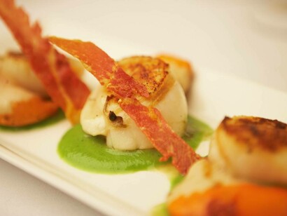 Elegant and refined courses such as shrimp on a bed of pea purée at Estbek House