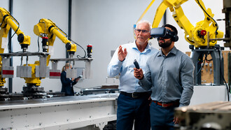 Business professionals using virtual reality headsets in an advanced robotics warehouse, conducting quality control inspections and evaluating next-generation automation systems in a smart factory environment