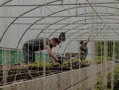 Staff members at the Small Holding restaurant tending to the garden