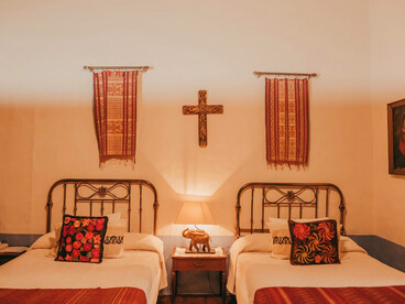 The room feels cozy, historic, and thoughtfully decorated, blending comfort with cultural character