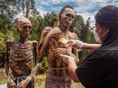 The Ma’nene ritual in Toraja, Indonesia, involves families exhuming and dressing their deceased ancestors, reflecting the deep respect and connection the Torajan people maintain with their forebears