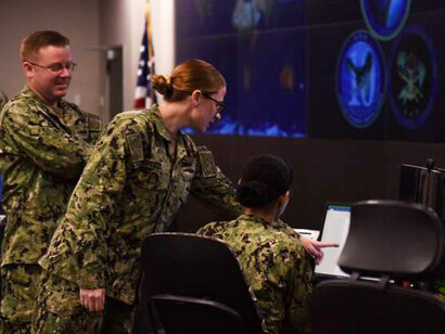 Sailors stand watch in the Fleet Operations Center at Fort George G. Meade, Maryland, home to U.S. Fleet Cyber Command/U.S. 10th Fleet and its worldwide cyber operations mission