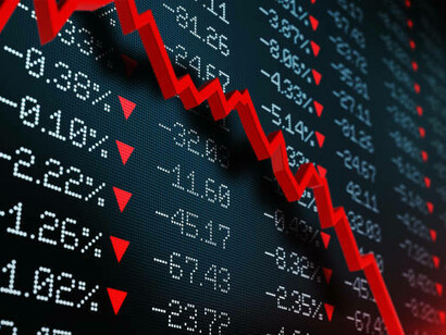 A falling stock market reflecting an ongoing economic crisis and recession