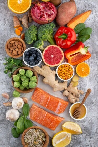 Fresh vegetables and fish arranged together as immunity-boosting superfoods