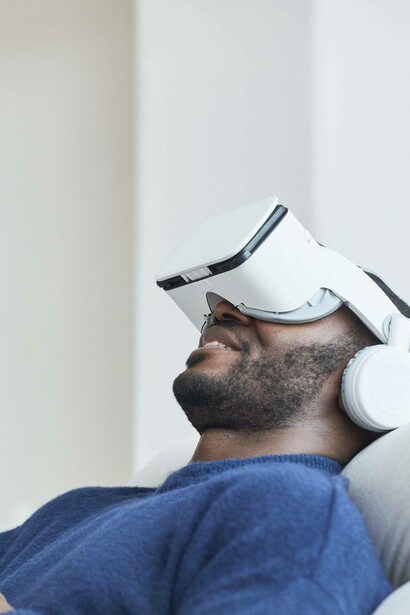 Man smiles as he explores artificial intelligence