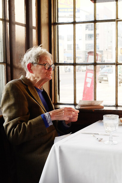 An old man eating alone ©Justin Bettman
