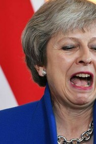 British Prime Minister Theresa May reacts during a meeting at 10 Downing Street in London