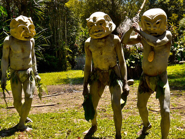 Asaro Mudmen in full regalia invoke their ancestors, clad in masks that blur the line between warrior and spirit