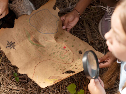 Children taking part in a treasure hunt actively explore their surroundings, engage in problem-solving tasks, and learn valuable skills while enjoying creative play that supports their brain development
