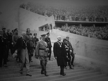 Adolf Hitler enters the Berlin Olympic Stadium through the Marathon Gate before the ceremonial opening of the 1936 XI Olympic Games, accompanied by Count Henri de Baillet-Latour, President of the International Olympic Committee, and Theodor Lewald, President of the German Olympic Committee