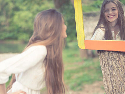 A poignant scene as a young woman peers into a forest mirror, exploring themes of self-reflection and narcissism amidst nature's embrace