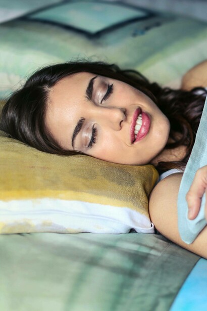 Woman is asleep comfortably, this is promoted by the  tryptophan in her diet