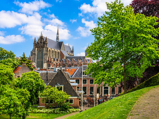 Scenic view of the historic Hooglandse Kerk and the surrounding traditional buildings along the canals of Leiden, Netherlands