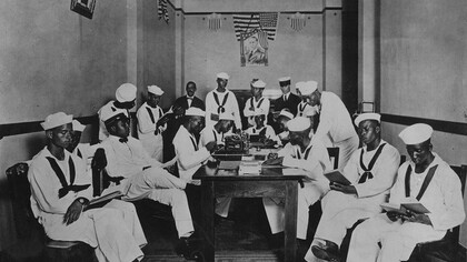 American Red Cross rest room for African American soldiers and sailors, most seen reading, ca. 1919