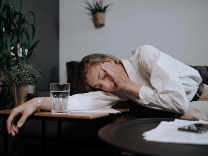 A woman suffering from a headache could be in need of some paracetamol