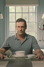 Jon Hamm portrays Andrew sitting amidst chaos, representing how the protagonist's life suddenly fell apart