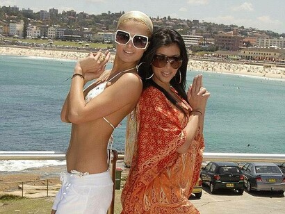 Paris Hilton and Kim Kardashian in their Charlie's Angels pose at the beach