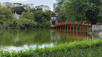The iconic Huc Bridge leading to Ngọc Sơn Temple over Hoàn Kiếm Lake, the legendary Lake of the Returned Sword © Photo by Daniel Gauss