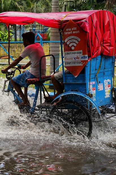Tricycle moves in the rain