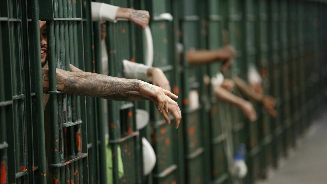 Men locked up in jail; many jails all over the world are packed and full of criminals