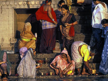 People in India seek relief from the extreme heat by cooling off in the water