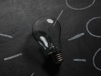 A lightbulb on a chalkboard as part of a diagram