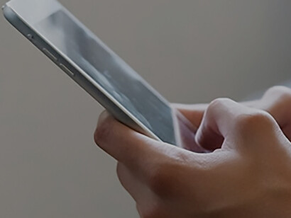 A person looking at a cell phone 