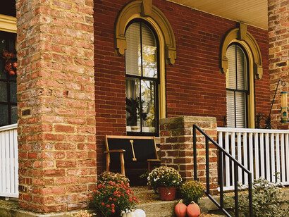 A warmly decorated house porch