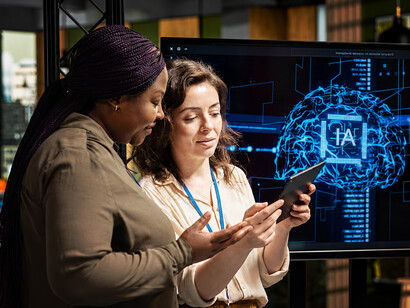 A team of coworkers using artificial intelligence and cloud computing technologies in a modern workplace