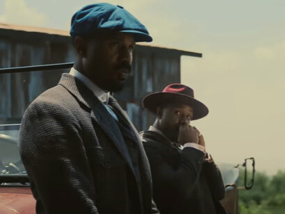 Michael B. Jordan stares down the Mississippi sun with quiet fury, embodying one half of his dual role in Sinners, where identity is as layered as the soil beneath their juke joint