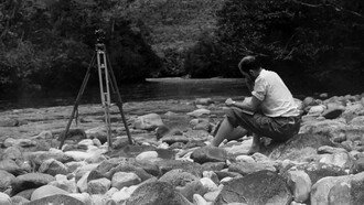 Perry Lowrey performing calculations to determine the height of Angel Fall. Photo by Ruth Robertson. Biblioteca Nacional de Venezuela Collection, Caracas