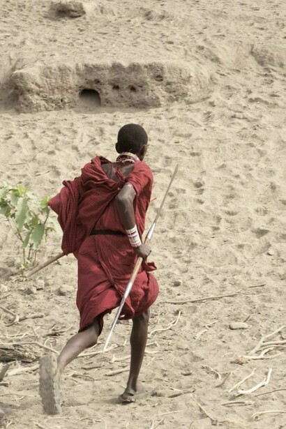 One Massai, running