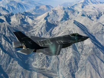 An Lockheed Martin F-35 Lightning II assigned to the Argonauts of Strike Fighter Squadron (VFA) 147 flies in formation during a photo exercise over Lemoore, California, on Nov. 16, 2018
