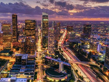 Downtown Los Angeles lit beneath a beautiful sunset, representing the city's ever-evolving creative energy