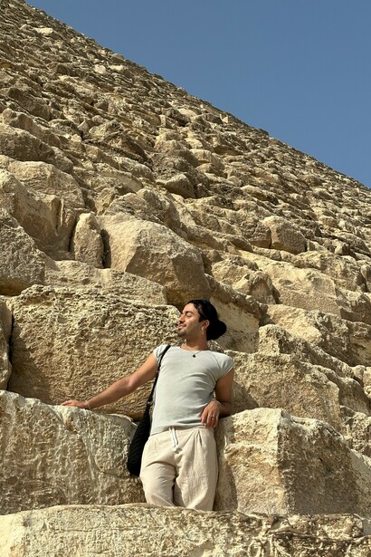 A close-up view of Egypt's majestic Giza Pyramids towering magnificently in the background